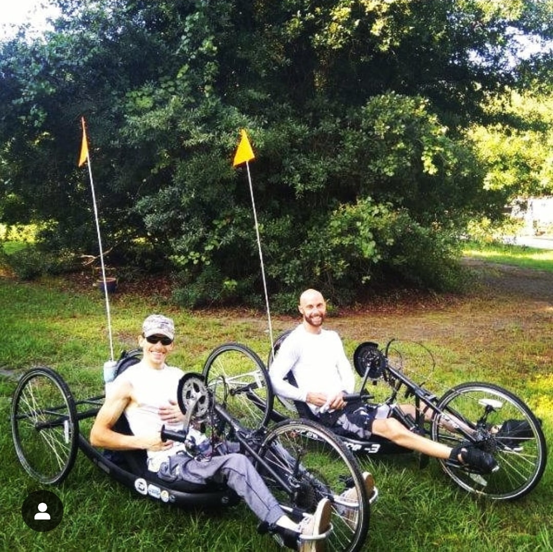 Picture of two men on special bikes equipped for mobility limited individuals