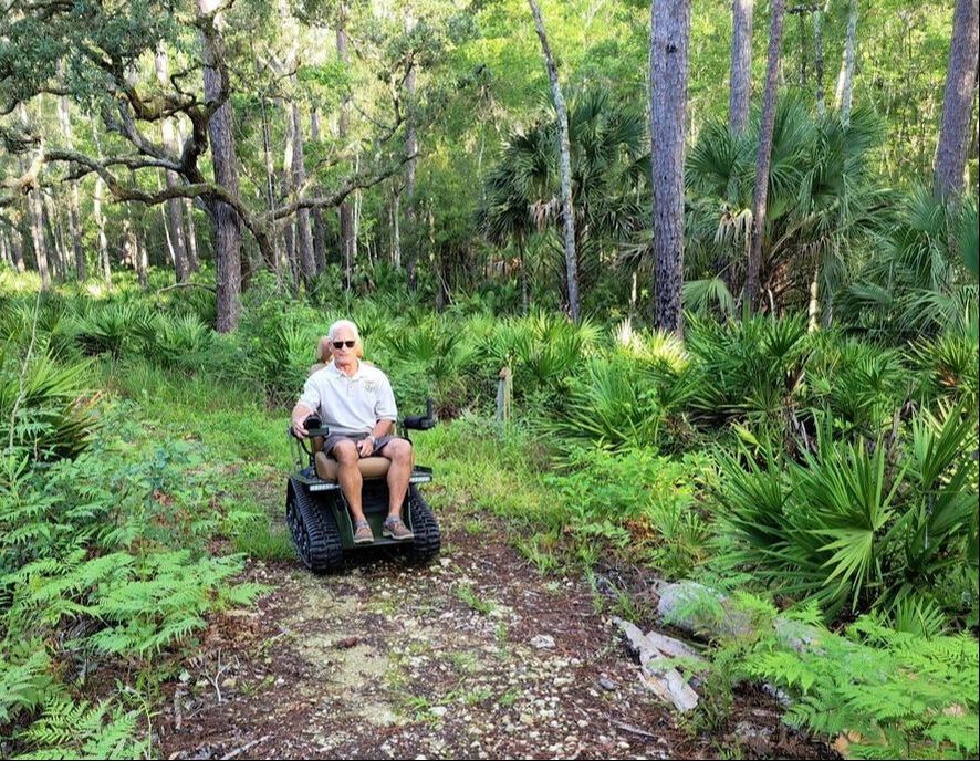 Picture of Refuge Manager Andrew Gude trying out the EcoRover on the River Trail