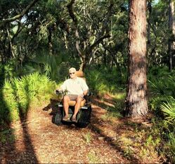 Picture of Refuge Manager Andrew Gude trying out the EcoRover on another section of the River Trail