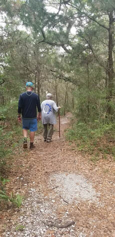 Picture of two people walking the Shell Mound Trail