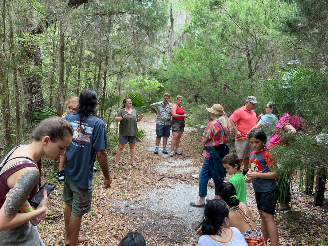 Board member Dr. Ginessa Mahar leading a tour at Shell Mound during the Summer Solstice Gathering 2021
