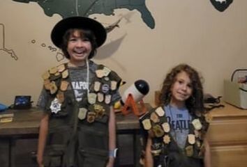 Picture two girls wearing junior ranger badges