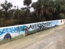 image of damage to bridge murals caused by vandalism